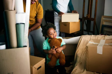 child and teddybear during moving house 